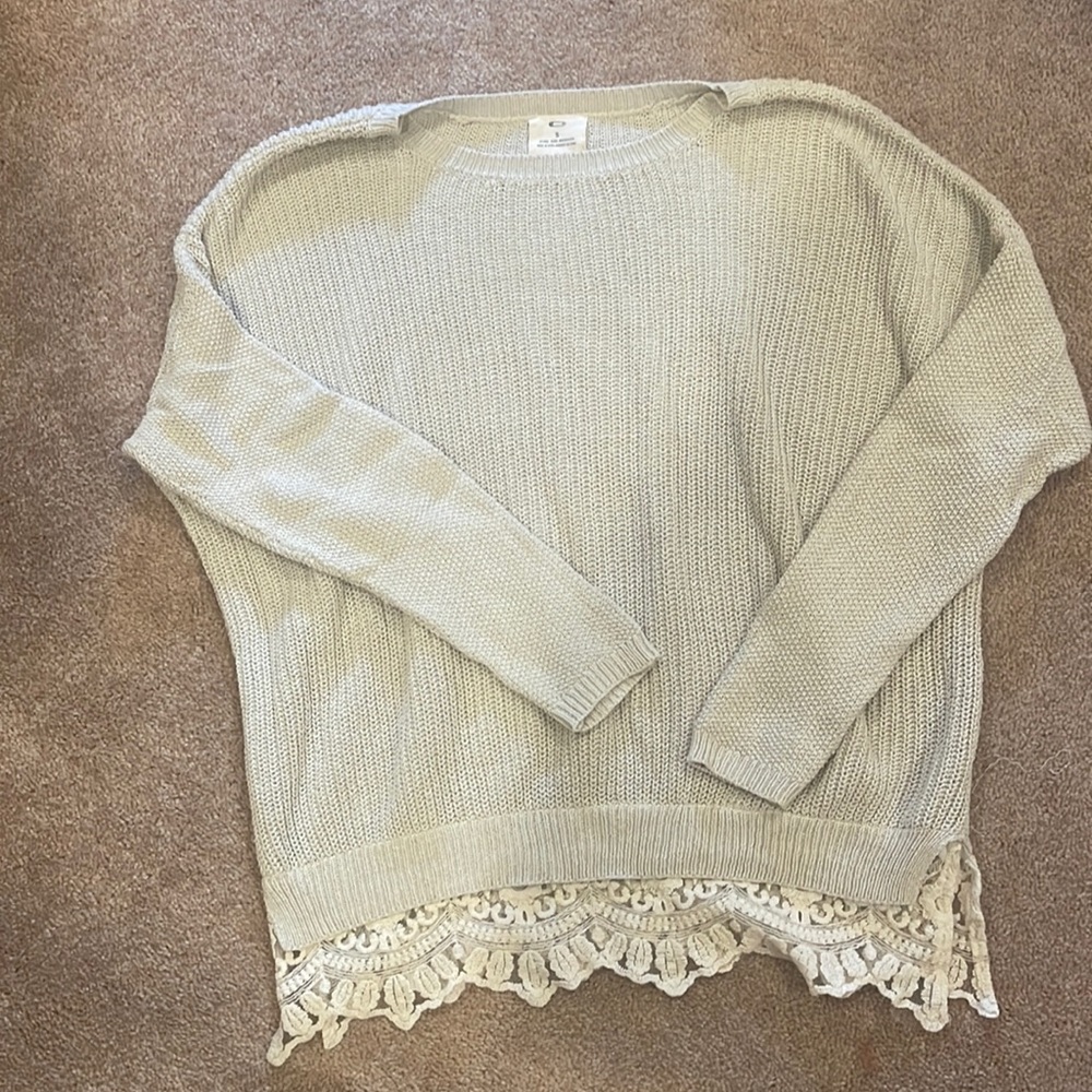 Sweater with lace underlay